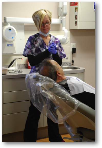 Heather prepares her patient for a regular cleaning